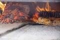 interior of a wood-fired oven with pizza cooking Royalty Free Stock Photo