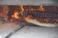 interior of a wood-fired oven with pizza cooking Royalty Free Stock Photo