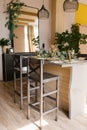 Interior of a wooden kitchen of a country house . Dining bar counter with chairs