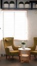 Yellow armchair and white table. interior Royalty Free Stock Photo