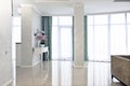 Interiors of the cottage: entrance hall with white furniture