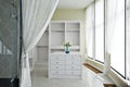 The interiors of the cottage: a large white wardrobe