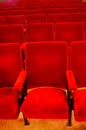 Interiors empty reddish cinema chairs seats in low-key indoors