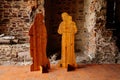 Interiors of gothic medieval castle tower, wooden figures of monk and merchant, fortress masonry wall, old stronghold, Velhartice