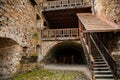 The interiors of gothic medieval castle tower, wooden stairs and floors, fortress masonry wall, old stronghold, Velhartice, Royalty Free Stock Photo