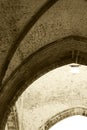 Interiors of a medieval church, sepia hue Royalty Free Stock Photo