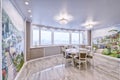 Interior of the living room in a spacious apartment in bright colors.