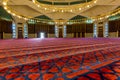 Interiors with red Arabic traditional carpet in King Abdullah I Mosque in Amman, Jordan, built in 1989 by late King Hussein in