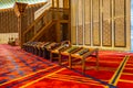 Interiors with red Arabic traditional carpet and Koran books in King Abdullah I Mosque in Amman, Jordan, built in 1989 by late