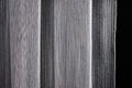 Interlacing of threads of fabric white sample for curtain on black background Royalty Free Stock Photo