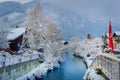 Interlaken landscape after snow in winter with river reflection, Swiss alps