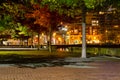 An interlock park path and treed in area along the lake shore at