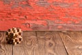 Interlocked wooden puzzle on a rustic background