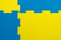 Interlocking blue and yellow EVA foam flooring tiles inside a gym, nursery, play room or school