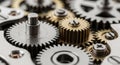 Interlocking gears of various sizes and materials, including silver and brass, creating a Royalty Free Stock Photo