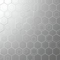 Interlocking hexagonal patterns create a seamless geometric design on a metallic silver Royalty Free Stock Photo