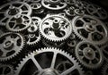 Interlocking metal gears in varying sizes, mostly consisting of circular shapes with teeth along Royalty Free Stock Photo
