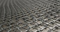 Interlocking metal mesh pattern, showcasing tightly woven steel links. The grid-like Royalty Free Stock Photo