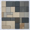 Interlocking paving stones arranged in a grid, featuring rectangular and square shapes. Royalty Free Stock Photo