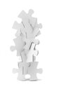 Interlocking pieces of jigsaw puzzles tower