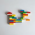 Interlocking plastic bricks in various colors, including red, blue, green, yellow, white, and Royalty Free Stock Photo