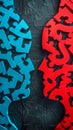 interlocking puzzle pieces in contrasting colors of blue and red, textured black background, complexity, connectivity