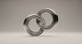 Interlocking Silver Rings on Neutral Background Creating Visual Harmony and Depth Ideal for Abstract Designs and Royalty Free Stock Photo
