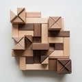 Interlocking wooden blocks is arranged in a geometric pattern on a white Royalty Free Stock Photo