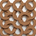 Interlocking wooden rings form a geometric pattern against a white background Royalty Free Stock Photo