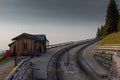 Intermediate station of narrow cog railway on the shafberg mountain in upper austria. Romantic view of old train track high up on