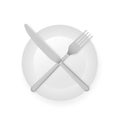 Intermittent fasting concept with knife and fork on white plate showing, cross symbol Royalty Free Stock Photo