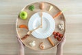 Intermittent fasting IF and keto diet concept with hour clock timer for eating nutritional or ketogenic food low carb Royalty Free Stock Photo