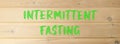 Intermittent fasting symbol. Concept words Intermittent fasting on beautiful wooden wall. Beautiful wooden wall background. Royalty Free Stock Photo