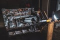 Internal combustion engine in a workshop, closeup. Repair service Royalty Free Stock Photo