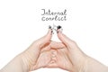 Internal conflict inscription.Two women`s hands of the same person, interlock fingers on white background. Clasped Hands