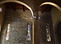 Internal facade of the cathedral of Barga in the province of Lucca in Tuscany, with three stained glass windows.