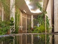 An internal garden with exotic trees and plants against the background of the luxurious modern interior of the hotel