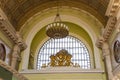 Internal interior of the Belorusskiy railway station written in Russian-- is one of the nine main railway stations in Moscow