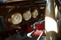 Vintage car dashboard featuring three gauges