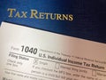 U.S. Tax Returns, Depicting The IRS 1040 Tax Form with its Luxury Binder