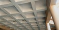 An internal roof ceiling design made of concrete and cement features a grid pattern Royalty Free Stock Photo