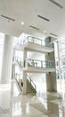an internal staircase connecting three floors in the atrium of an office building Royalty Free Stock Photo