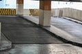 An internal view of a multi-level parking structure showing the entrance or exit ramp for vehicles. Royalty Free Stock Photo