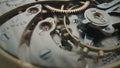 Internal vintage clockwork mechanism macro. Gold gears, metal gearing, wheels with tootheds. Disassembled watch with Royalty Free Stock Photo