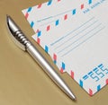 International air mail envelopes and a pen Royalty Free Stock Photo