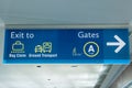 International Airport Sign Exit to Ground Transportation Baggage Claim Gates A in air terminal Royalty Free Stock Photo