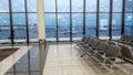 International Airport terminal hall, view of the airfield through the window, travel concept Royalty Free Stock Photo