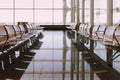 international airport terminal view with empty seats in waiting Royalty Free Stock Photo