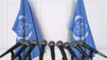 International Atomic Energy Agency IAEA official press conference. Flags and microphones. Conceptual editorial 3D