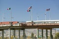 International border of Mexico & the United States, with flags and walking bridge connecting El Paso Texas to Juarez, Mexico